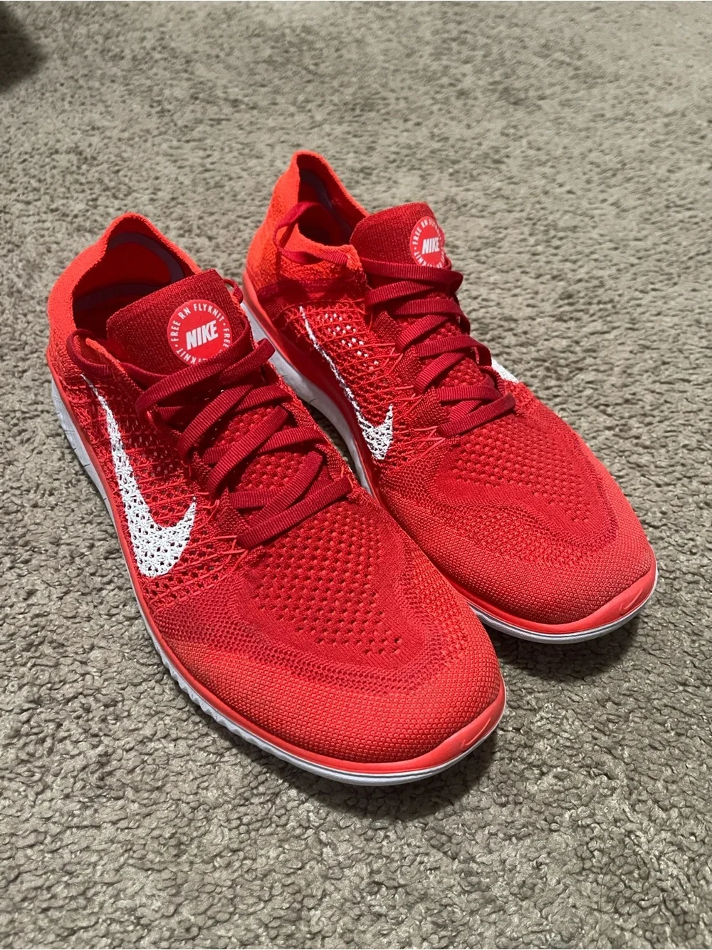 Nike Men’s Red Flyknit Sneakers with White Swoosh